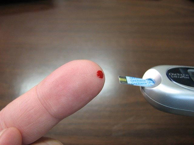 diabetes, blood, glucose testing. finger prick with drop of blood