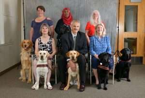 Oregon Guide Dog Graduation Class recognizing that they are working dogs