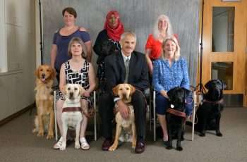 Oregon Guide Dog Graduation Class recognizing that they are working dogs